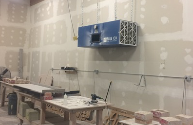 Granite fabrication shop with dust control and air filtration system installed